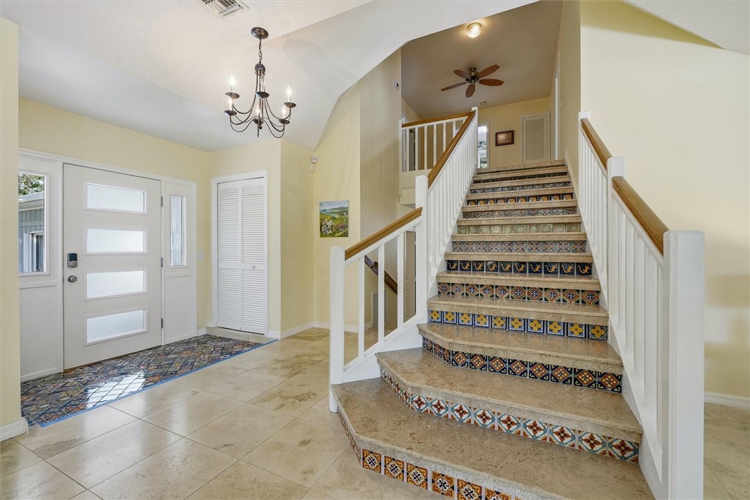Foyer area with tiled stairway