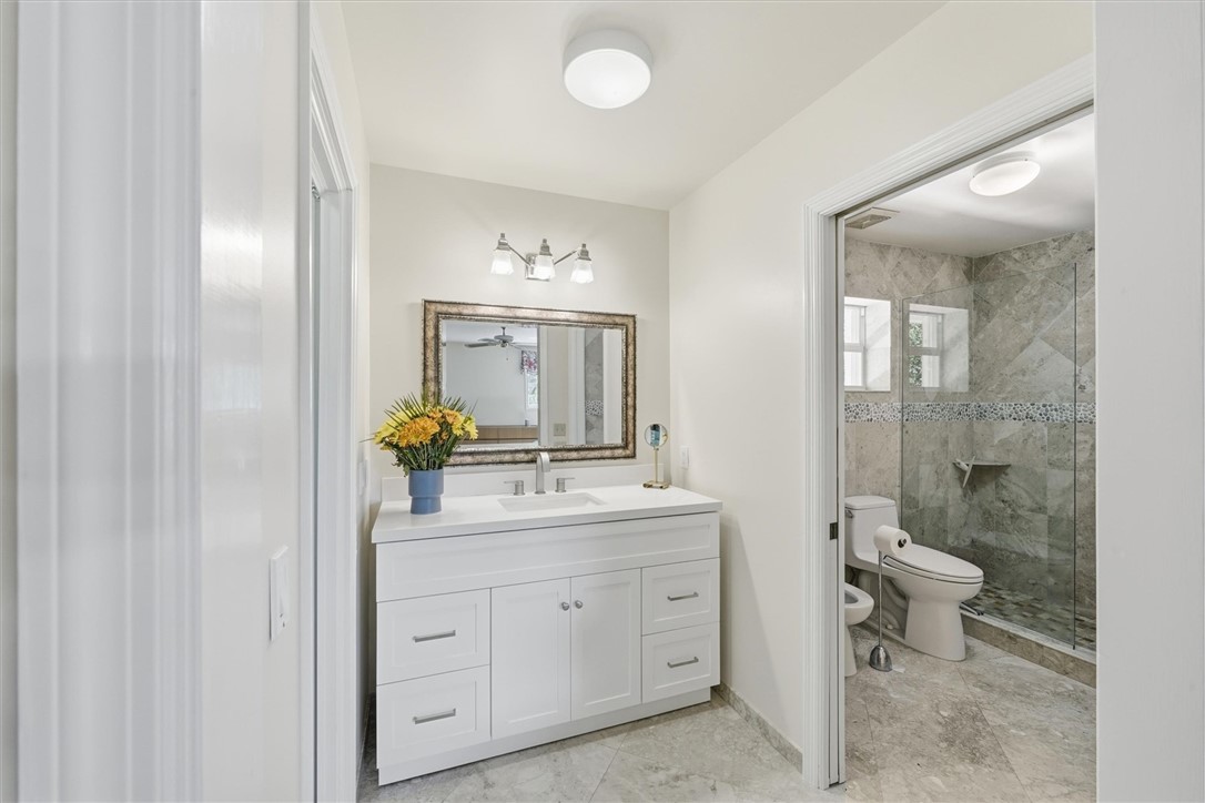 Primary Bathroom offers walk in dressing room