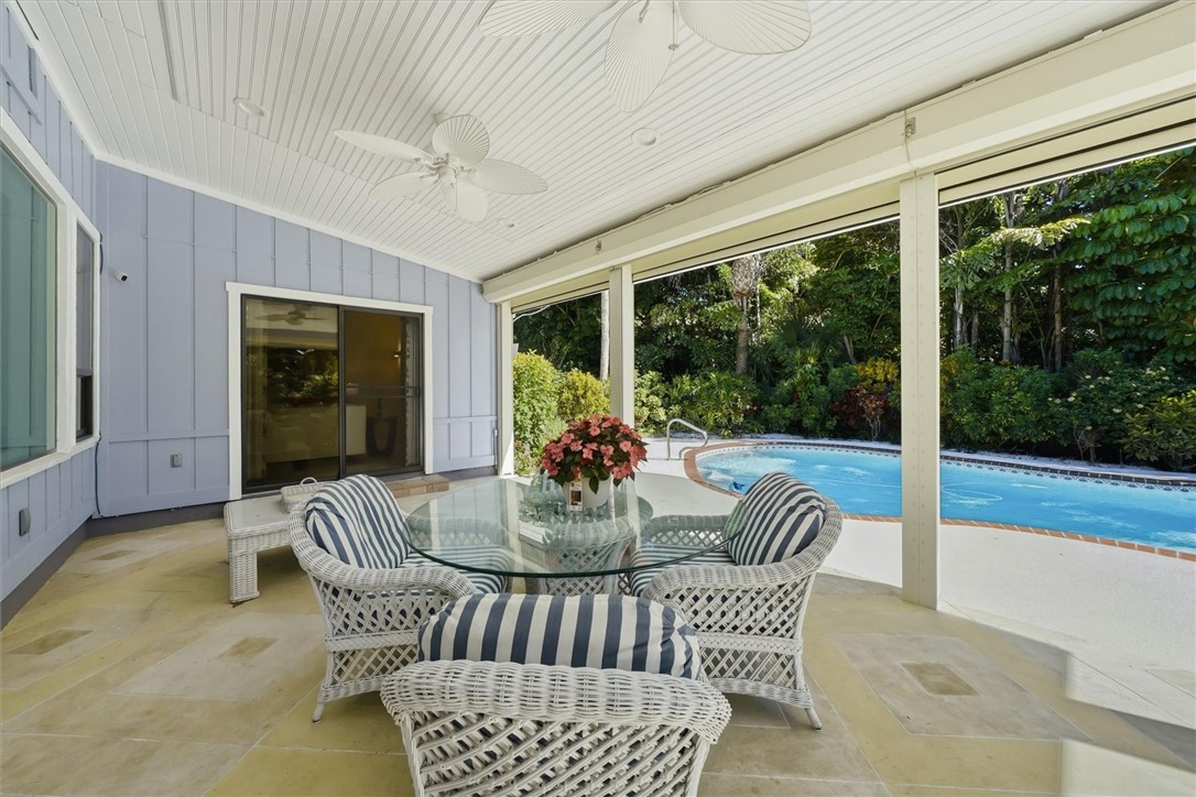Outdoor tiled patio area with wood ceiling finish