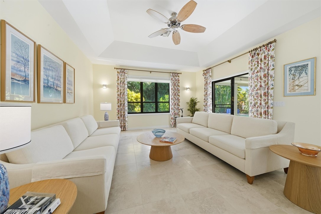 Living room area leading to outdoor patio/pool are