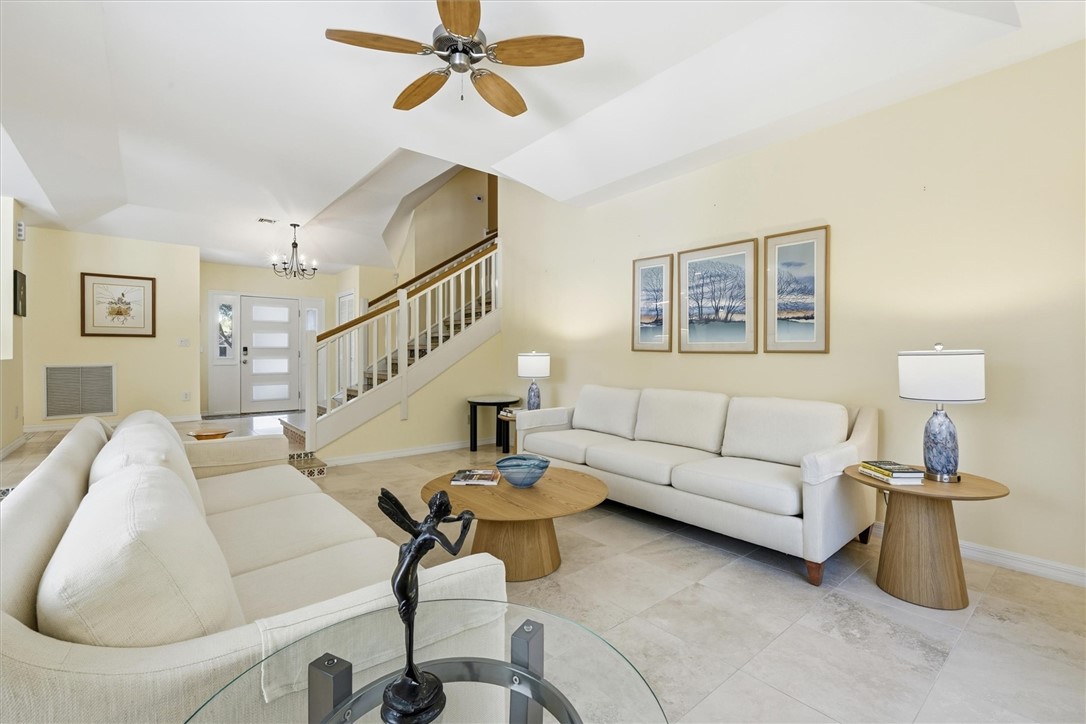 Living room area with stairway leading to second f