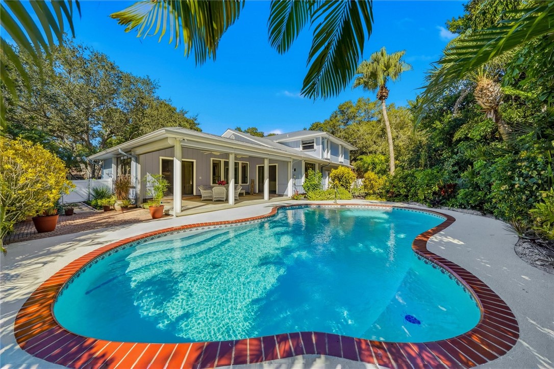 Newly refinished heated Swimming pool featuring a