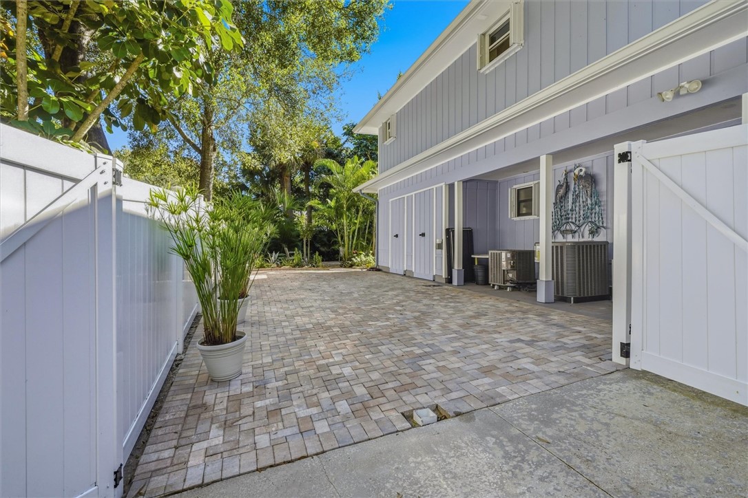 Paver RV pad fenced on side yard with Utility Shed