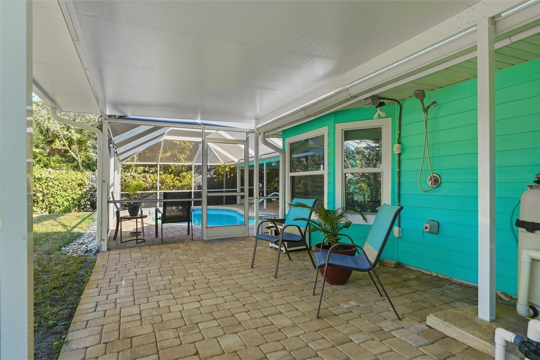 View of patio featuring a covered lanai and outdoo