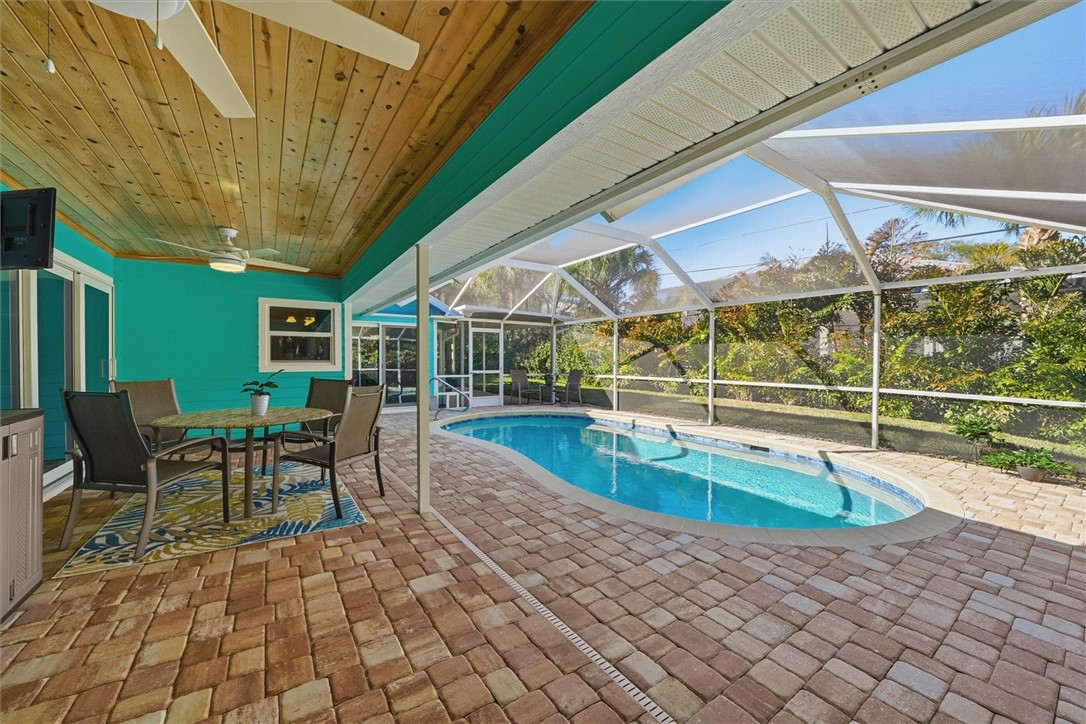 Swimming pool featuring outdoor dining area with t