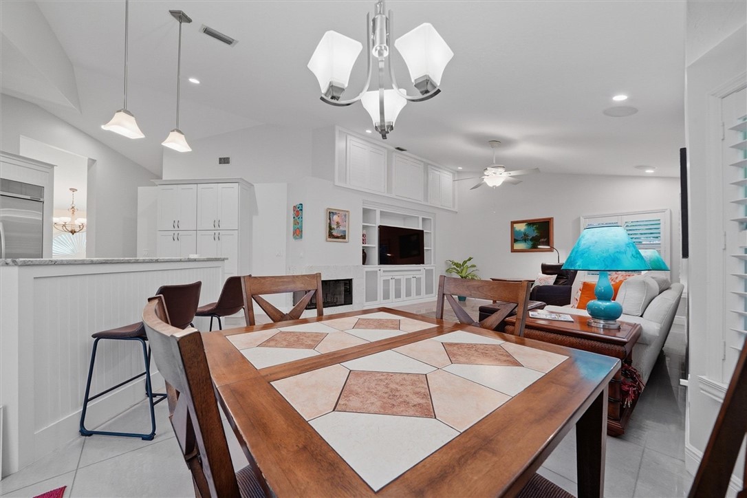 Open concept living dining with built in shelves f