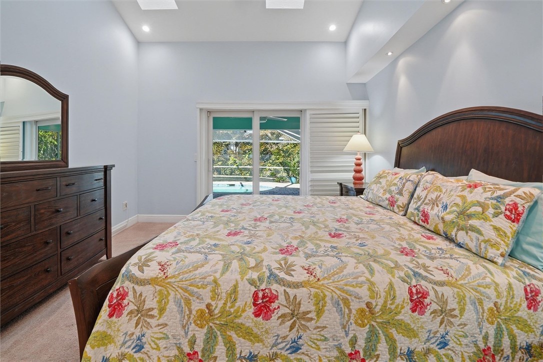 Primary bedroom suite with access to pool