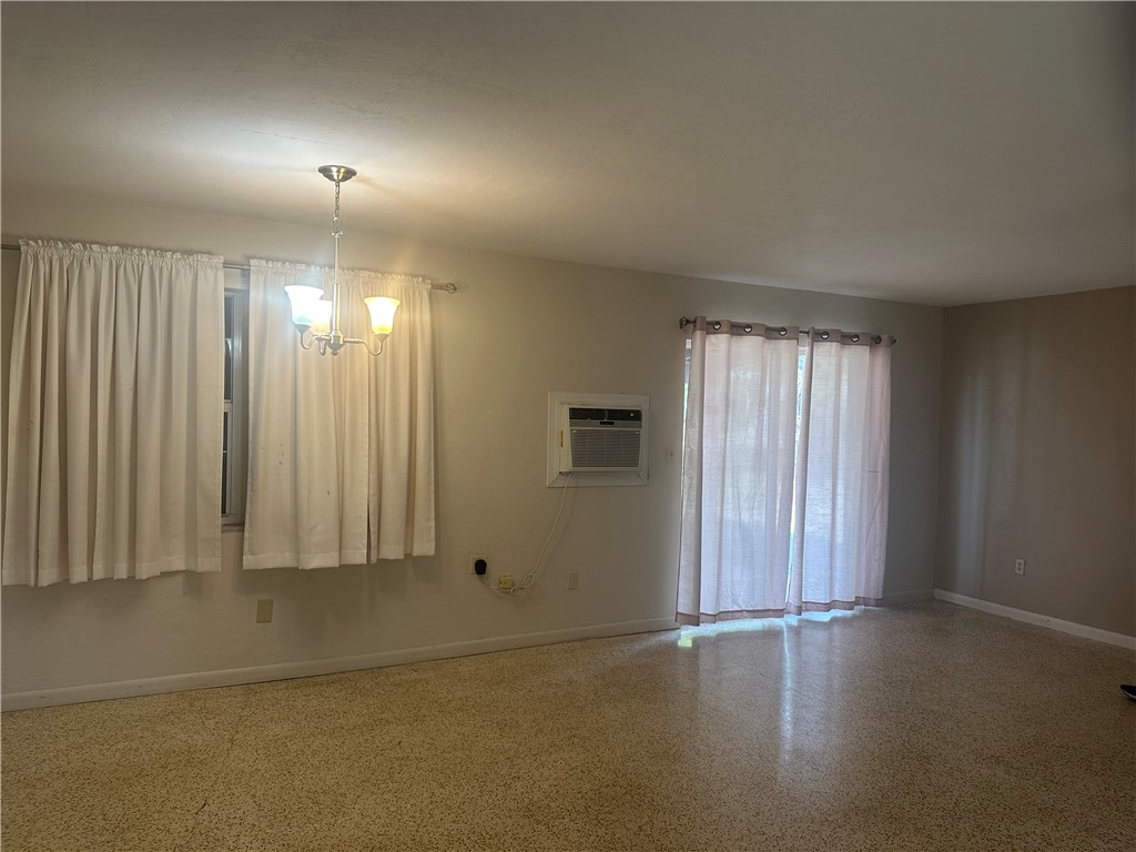 Living room with sliding glass door leading to scr