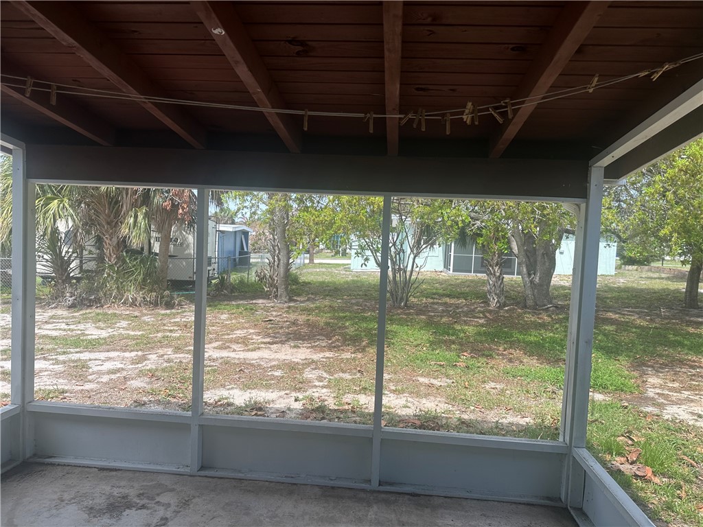 Screened porch with beam ceiling