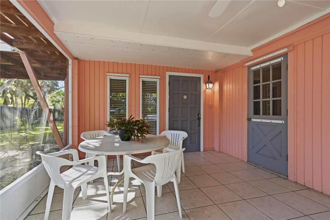 Screened in porch leading to front door