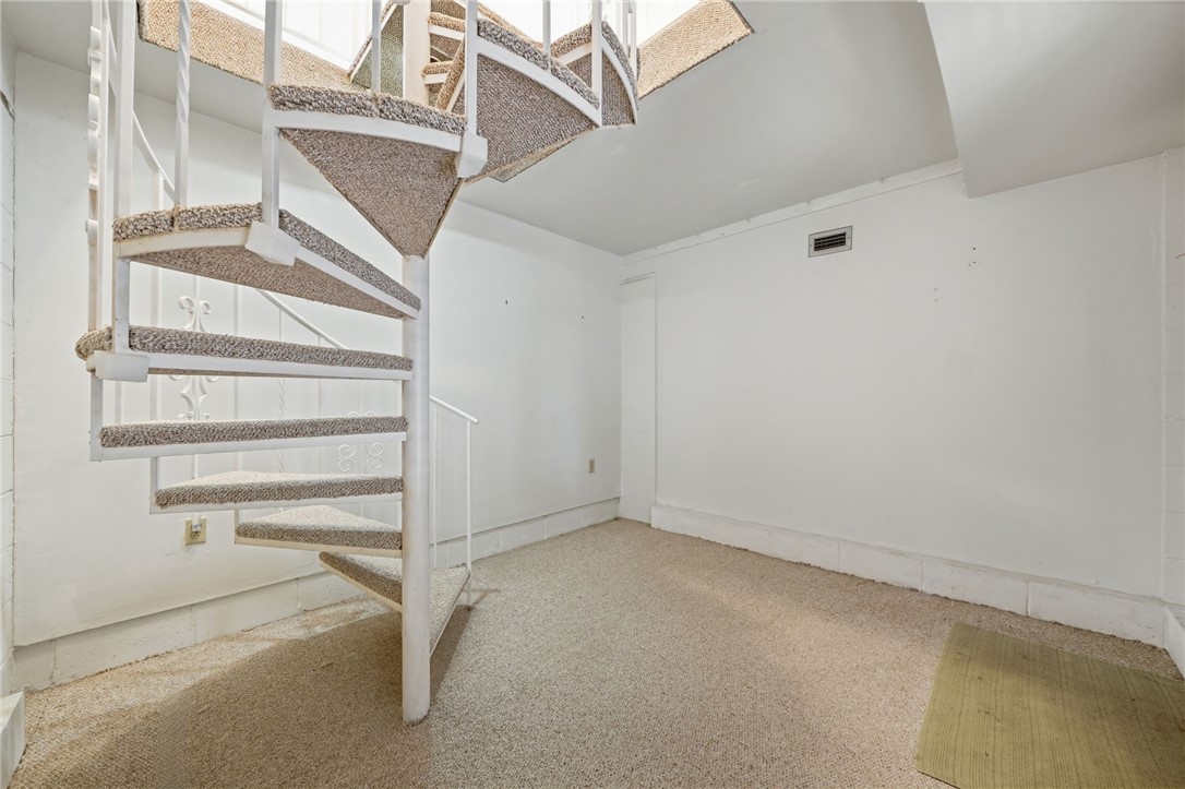 Spiral staircase leading to 2nd floor