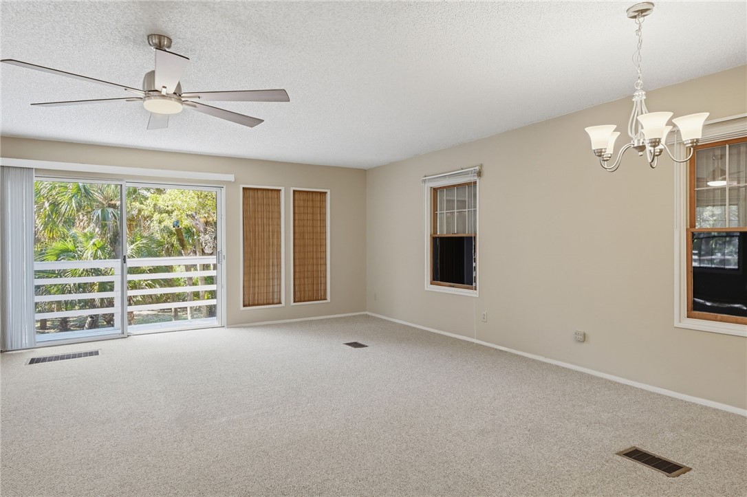 Open area with sliding doors leading to deck