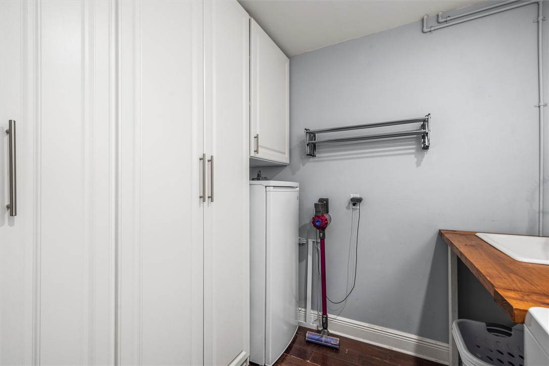 Dedicated utility space featuring extensive white