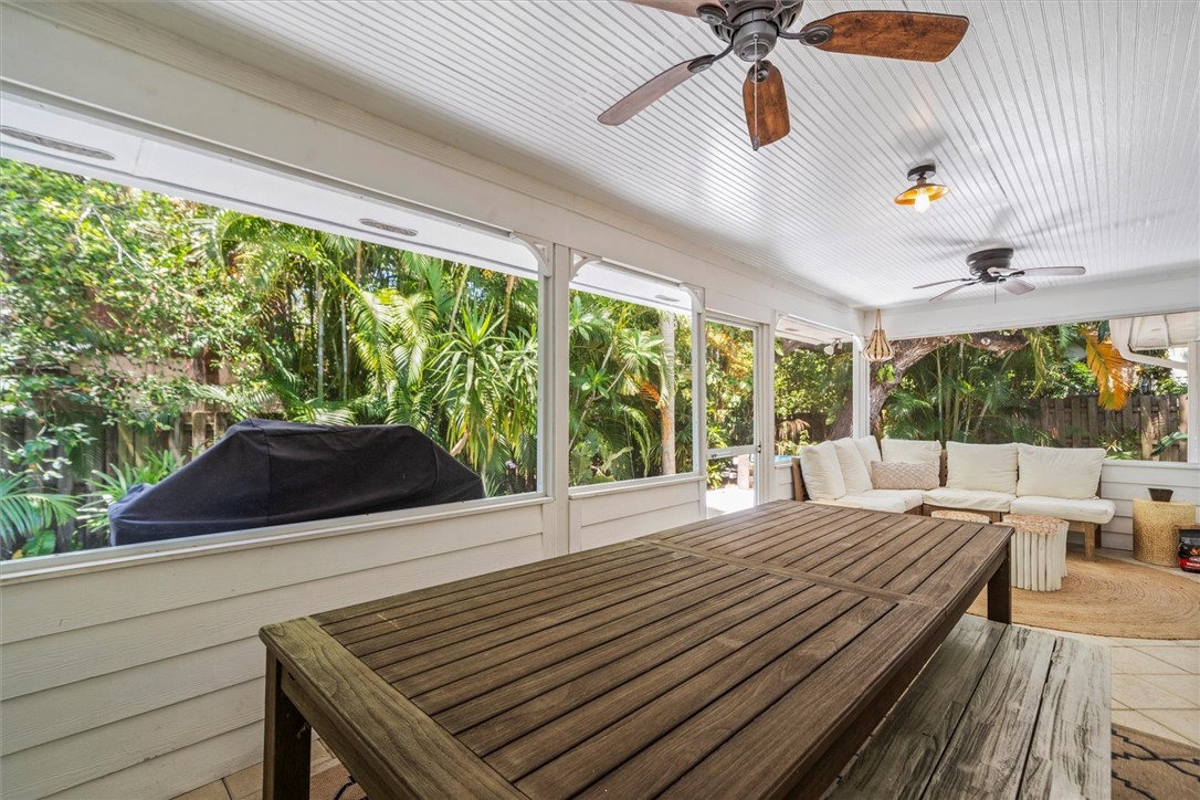 Screened patio featuring a wood-slat ceiling, mult
