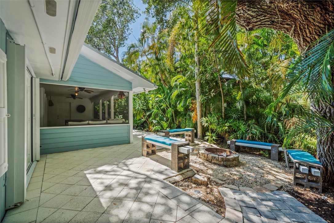 Expansive outdoor living area featuring a screened