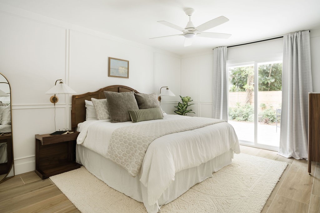 Primary Bedroom featuring a sliding glass impact d
