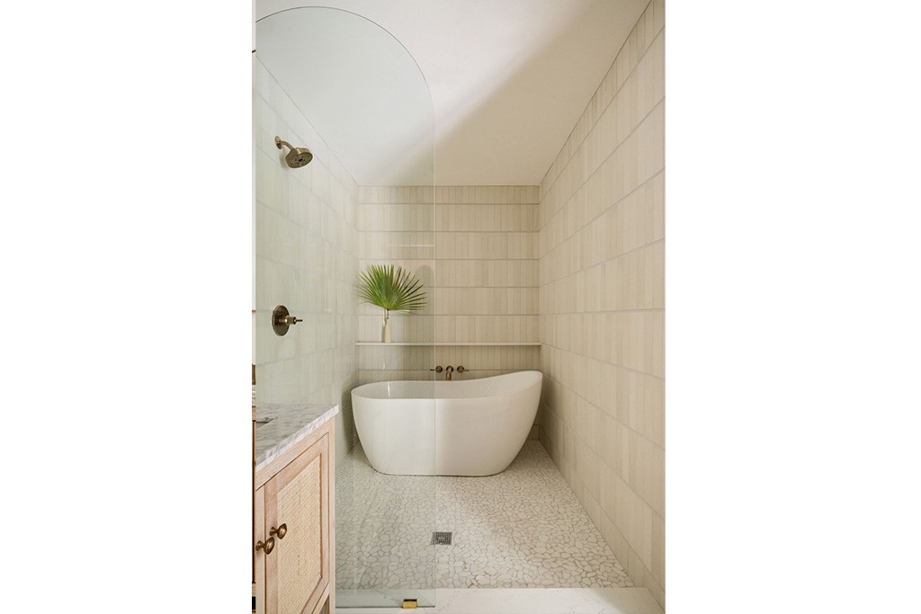Freestanding soaking tub and shower with a wall-mo