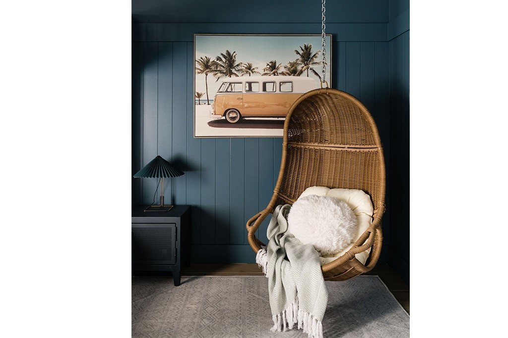 3rd bedroom with vertical paneling on walls with a