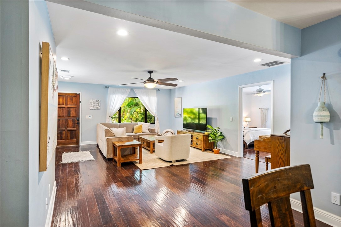 Open concept living area featuring dark wood-finis