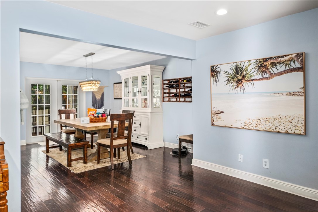 Open dining area featuring a decorative chandelier