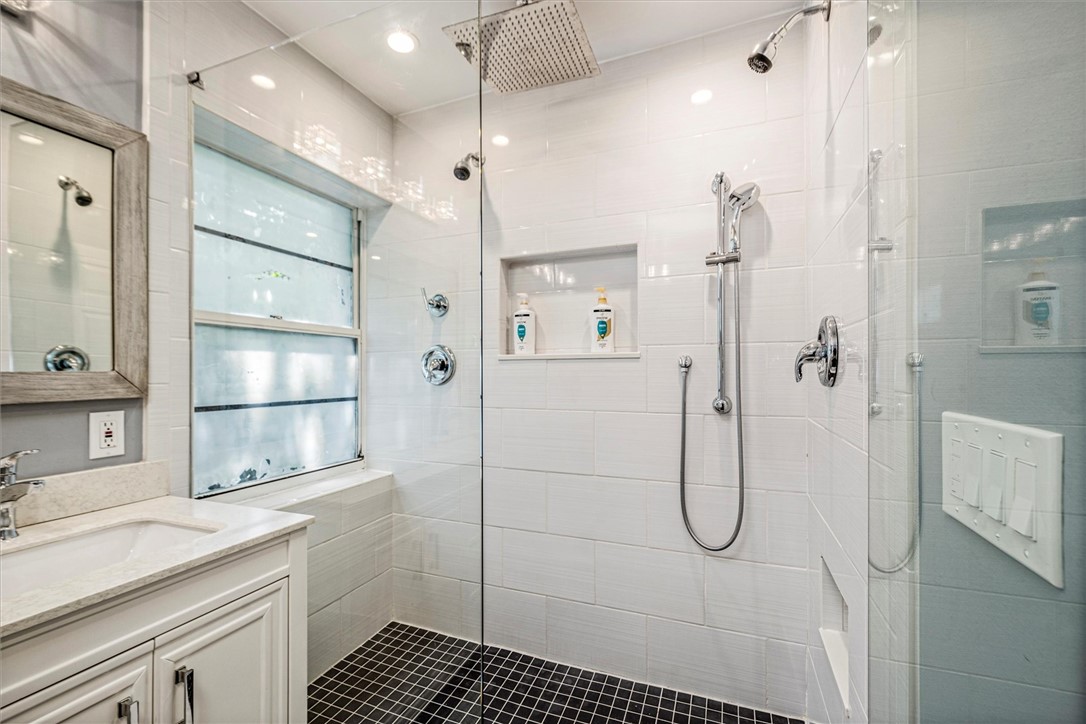Large Modern bathroom featuring a walk-in shower w