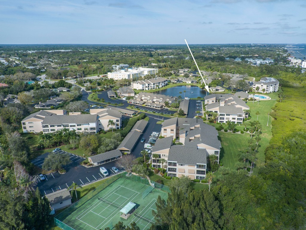 Multi-story residential buildings set within a lan