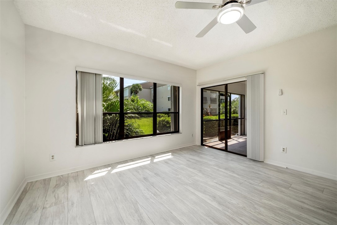 Expansive living area with light wood-finish floor