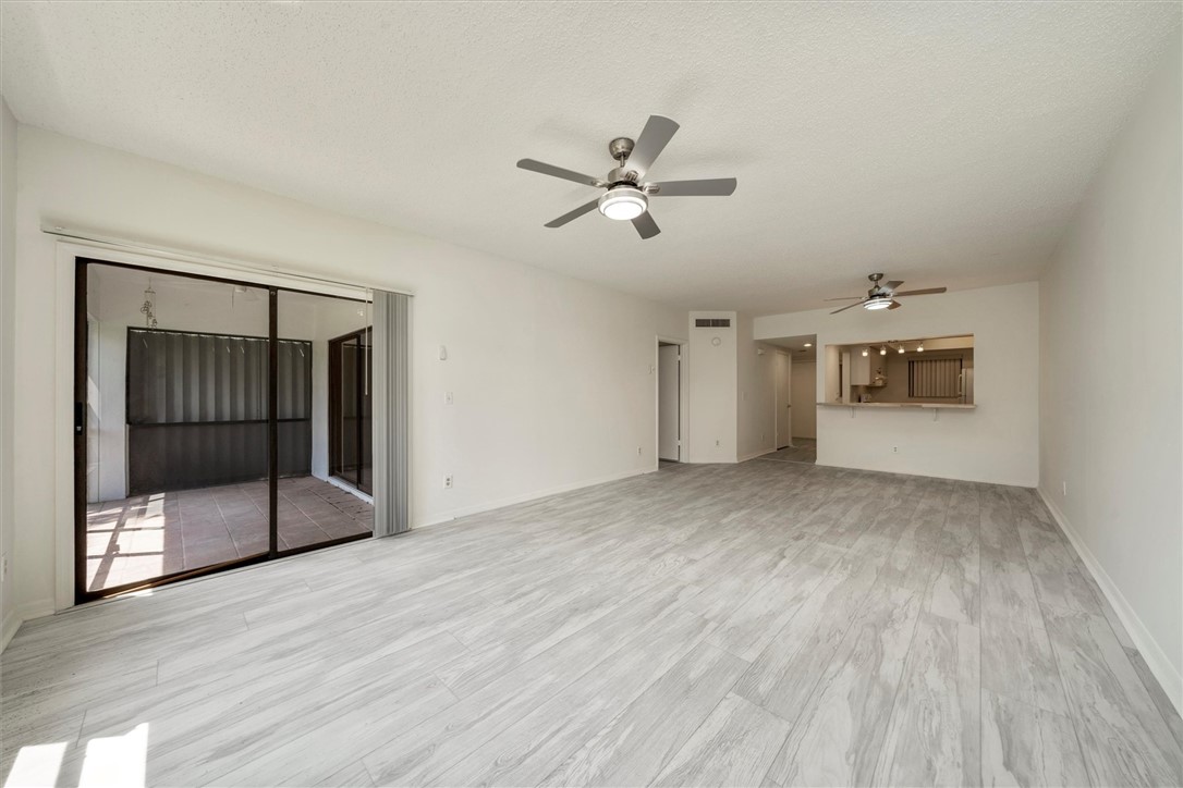Spacious interior featuring wood-finish flooring,
