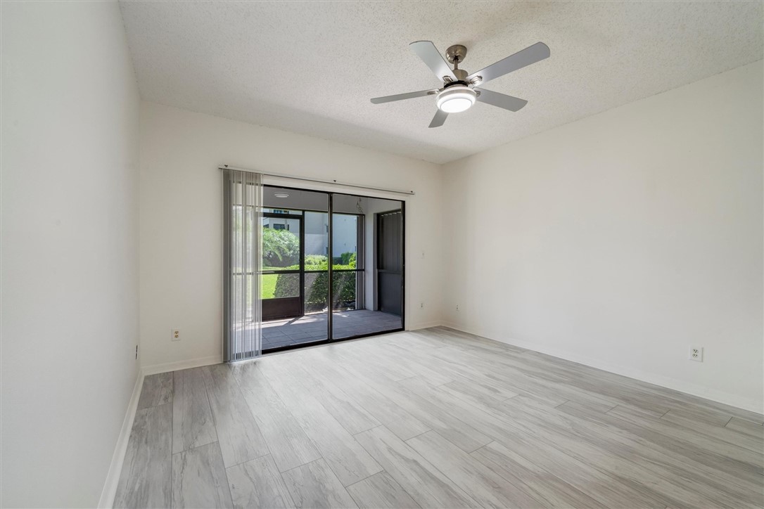 Sliding glass doors opening to an outdoor patio wi