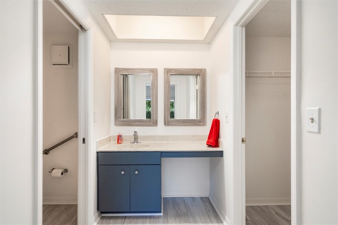 Primary Bathroom vanity featuring a single sink, l
