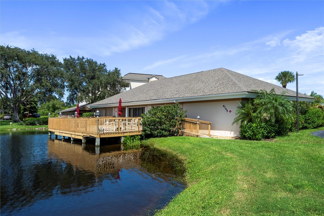 Waterside property with a spacious wood deck over