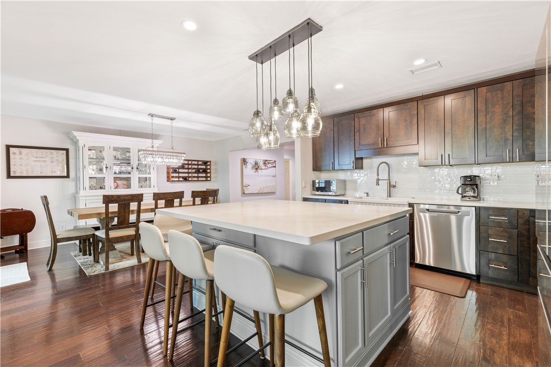 Kitchen island featuring a light-toned countertop