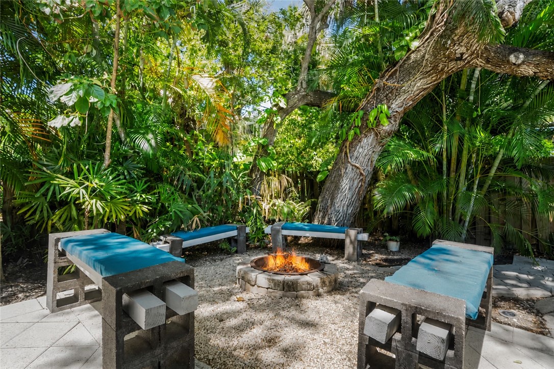 Fire pit area with gravel groundcover, surrounded