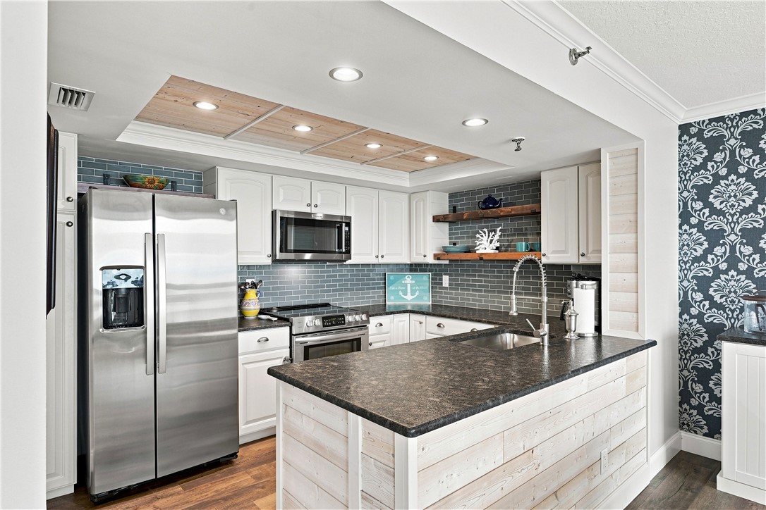 Kitchen featuring high end stainless steel applian