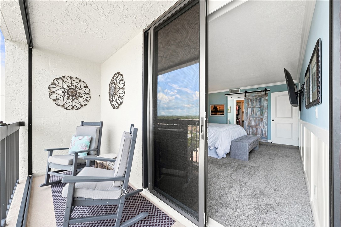 Balcony access from Primary bedroom with polywood