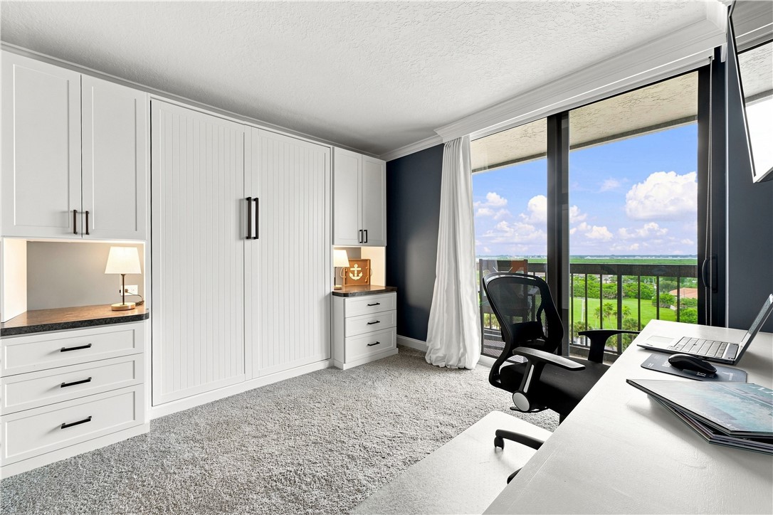 2nd bedroom as an office, carpeted with River view
