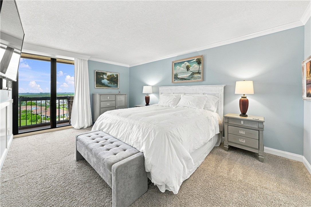 Primary bedroom with impact sliding door with acce