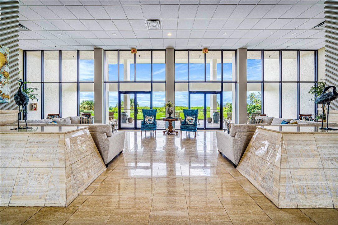 Lobby entrance with marble flooring and grand pian