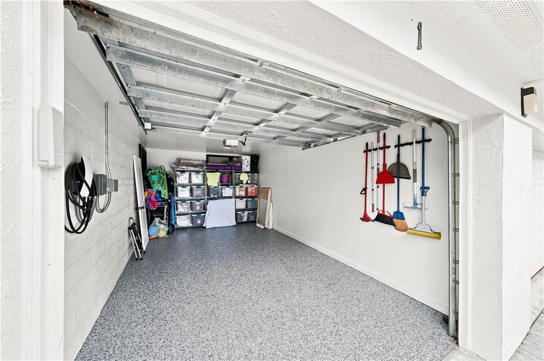 New Epoxy-coated concrete flooring, garage door, d